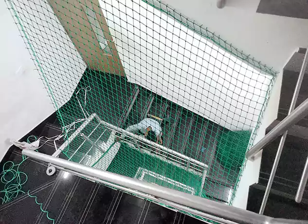 Safety net fitted across a staircase void